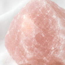 Load image into Gallery viewer, Close-up of authentic natural Rose Quartz showing crystal texture, colour and craftsmanship – rose quartz raw stone symbol of love compassion and emotional
