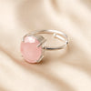 Rose Quartz Adjustable Ring displayed fully on white silk cloth to show its natural colour, shape and finish