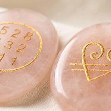 Load image into Gallery viewer, Close-up of authentic natural Rose Quartz showing crystal texture, colour and craftsmanship – rose quartz zibu coin healing crystal for love healing positivity
