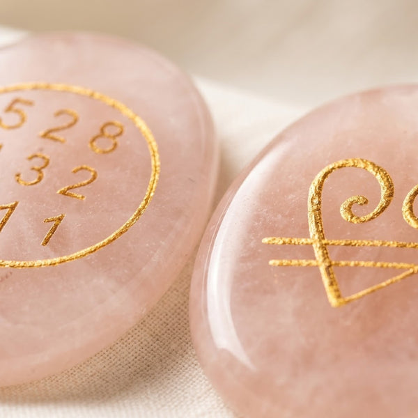 Close-up of authentic natural Rose Quartz showing crystal texture, colour and craftsmanship – rose quartz zibu coin healing crystal for love healing positivity