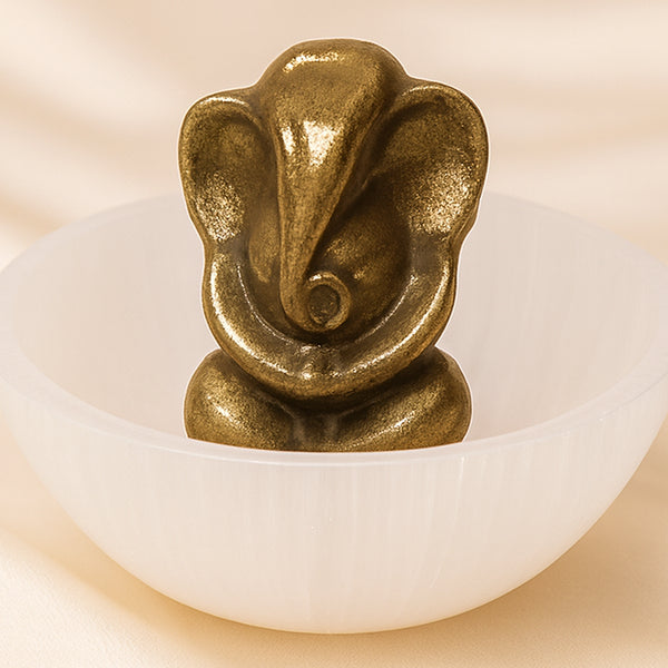 Close-up of authentic natural Selenite and Pyrite showing crystal texture, colour and craftsmanship – selenite bowl and pyrite ganesh set symbols of purity