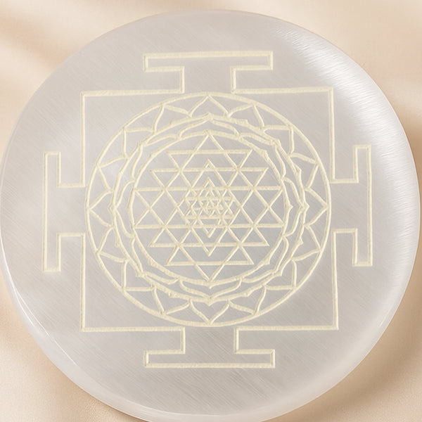 Close-up of authentic natural Selenite showing crystal texture, colour and craftsmanship – selenite charging plate sri yantra engraved energy cleansing healing