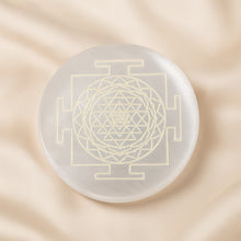 Load image into Gallery viewer, Selenite Sri Yantra Charging Plate displayed fully on white silk cloth to show its natural colour, shape and finish – selenite charging plate sri yantra
