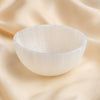 Selenite Bowl displayed fully on white silk cloth to show its natural colour, shape and finish