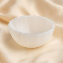 Load image into Gallery viewer, Selenite Bowl displayed fully on white silk cloth to show its natural colour, shape and finish
