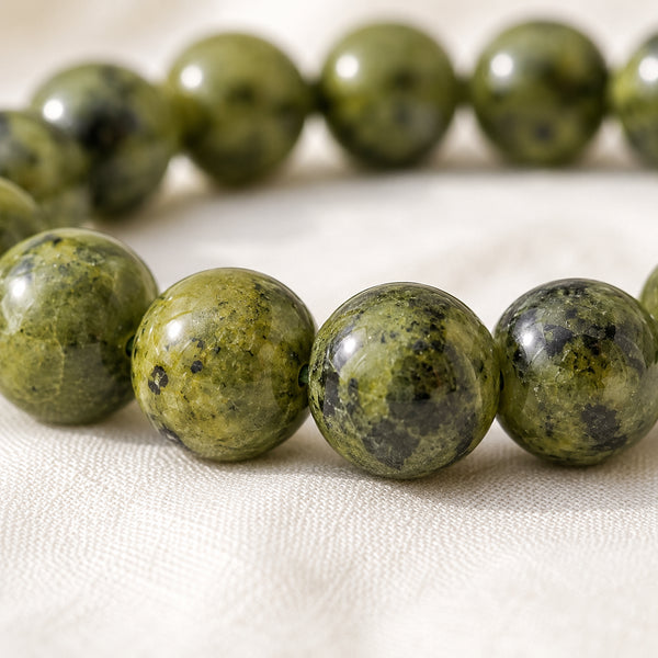 Close-up of authentic natural Serpentine showing crystal texture, colour and craftsmanship