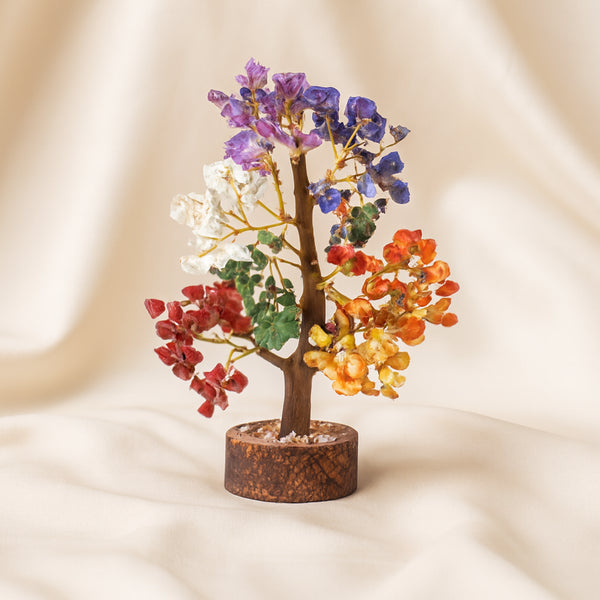 7 Chakra Gemstone Crystal Tree displayed fully on white silk cloth to show its natural colour, shape and finish