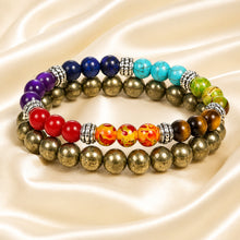 Load image into Gallery viewer, 7 Chakra &amp; Pyrite Bracelet Set displayed fully on white silk cloth to show its natural colour, shape and finish
