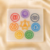 Square Selenite 7 Chakra Charging Plate displayed fully on white silk cloth to show its natural colour, shape and finish