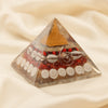 Shree Yantra Pyramid displayed fully on white silk cloth to show its natural colour, shape and finish
