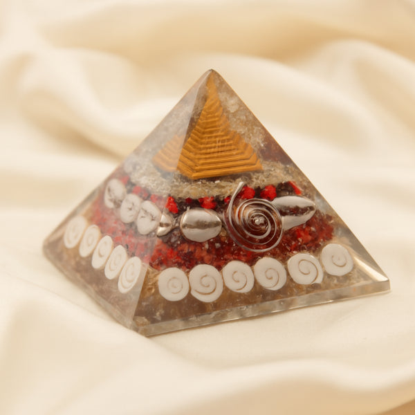 Shree Yantra Pyramid displayed fully on white silk cloth to show its natural colour, shape and finish