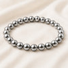 Silver Hematite Bracelet displayed fully on white silk cloth to show its natural colour, shape and finish