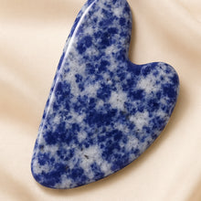 Load image into Gallery viewer, Close-up of authentic natural Sodalite showing crystal texture, colour and craftsmanship – sodalite gua sha symbol of clarity communication and intuition
