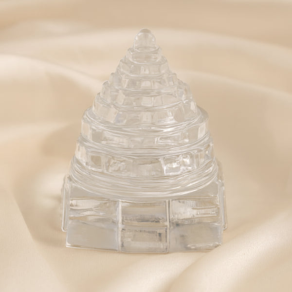 Sphatik Shree Yantra displayed fully on white silk cloth to show its natural colour, shape and finish