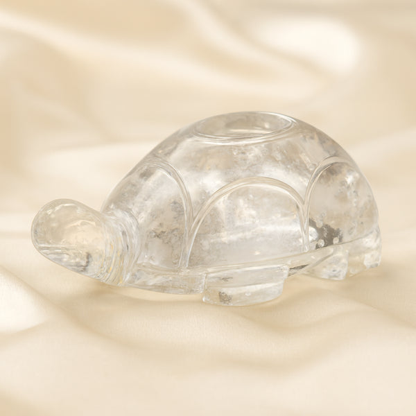 Sphatik Tortoise displayed fully on white silk cloth to show its natural colour, shape and finish