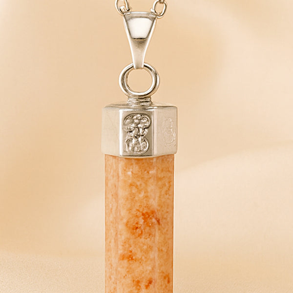 Close-up of authentic natural Sunstone showing crystal texture, colour and craftsmanship – sunstone pencil pendant chain healing crystal for energy confidence