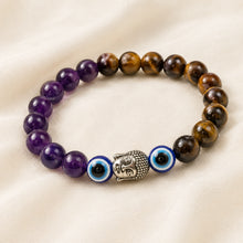 Load image into Gallery viewer, Tiger Eye, Amethyst &amp; Evil Eye Bracelet displayed fully on white silk cloth to show its natural colour, shape and finish – tiger eye amethyst evil eye bracelet
