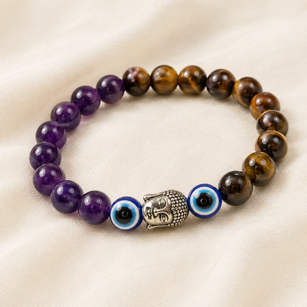 Tiger Eye, Amethyst & Evil Eye Bracelet displayed fully on white silk cloth to show its natural colour, shape and finish – tiger eye amethyst evil eye bracelet
