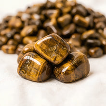 Load image into Gallery viewer, Close-up of authentic natural Tiger Eye showing crystal texture, colour and craftsmanship – tiger eye chips stone symbol of courage focus and practicality
