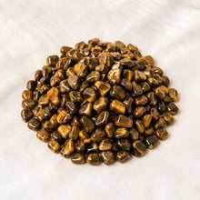 Load image into Gallery viewer, Tiger Eye Chips displayed fully on white silk cloth to show its natural colour, shape and finish
