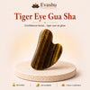 Authentic natural Tiger Eye Gua Sha for Tension Release and Contour Focus, shown as the main Evashu product view