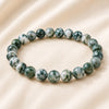 Agate Bracelet displayed fully on white silk cloth to show its natural colour, shape and finish