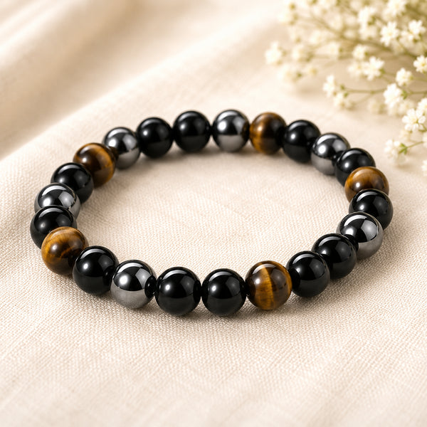 Triple Protection Bracelet displayed fully on white silk cloth to show its natural colour, shape and finish
