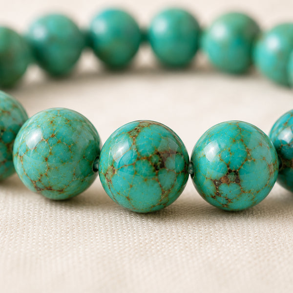 Close-up of authentic natural Turquoise showing crystal texture, colour and craftsmanship