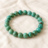 Turquoise Green Bracelet displayed fully on white silk cloth to show its natural colour, shape and finish