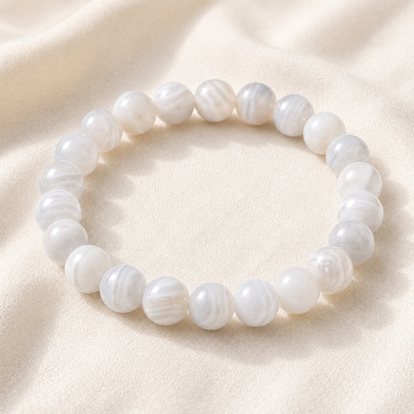 White Agate Bracelet displayed fully on white silk cloth to show its natural colour, shape and finish