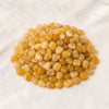 Yellow Aventurine Chips displayed fully on white silk cloth to show its natural colour, shape and finish