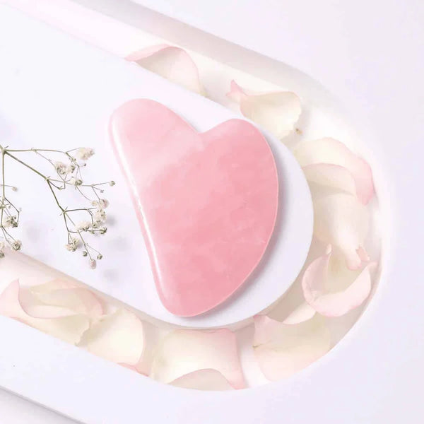 Rose Quartz Gua Sha tool for face care, promoting smooth skin, radiance, and loving energy.