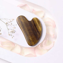 Load image into Gallery viewer, Tiger Eye Gua Sha tool for face massage, promoting facial balance, energy and strength.
