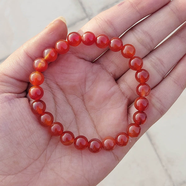A collection of Carnelian bracelet showcasing different styles and sizes along with their Carnelian bracelet benefits.