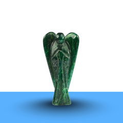 Green Aventurine Angel figurine on a minimalist white and blue background symbolizing luck and healing.