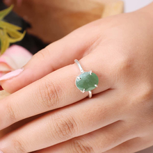 Load image into Gallery viewer, Green Aventurine diamond cut oval ring on finger, known for luck, prosperity and emotional healing benefits.
