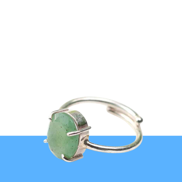 Green Aventurine oval diamond cut ring displayed on a minimalist white background with blue accents 