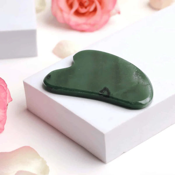 Green Jade beauty Gua Sha crystal featured for cooling, skin renewal, and prosperity enhancement.