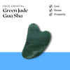 Green Jade Gua Sha face crystal displayed for cooling, renewing, and promoting prosperity in skincare.