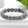 The Black Picasso Jasper bracelet with a focus on its vibrant color and unique texture.