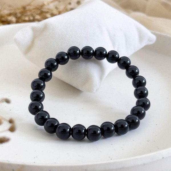 A collection of Black Onyx bracelet showcasing different styles and sizes along with their Black Onyx bracelet benefits.