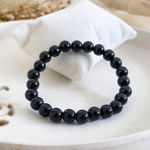Load image into Gallery viewer, A collection of Black Onyx bracelet showcasing different styles and sizes along with their Black Onyx bracelet benefits.
