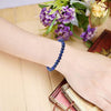 Spiritual Connection & Confidence: Original Blue Lapis Lazuli Round Beaded Bracelet for Unisex - In Use View | Natural Lapis Lazuli, Seven Chakra Crystal Bracelet for Success, Confidence & Career Growth