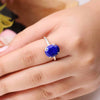 Diamond-cut Lapis Lazuli gemstone ring showcased on a finger, highlighting its faceted finish and elegant band.