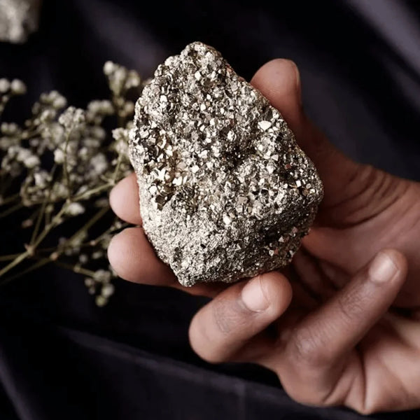 Natural pyrite raw stone cluster symbolizing willpower, action, and fortune.