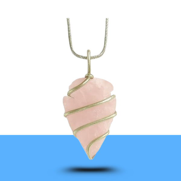 Polished rose quartz arrowhead gemstone pendant symbolizing love and strength