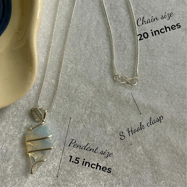 Opalite arrowhead pendant with chain displayed on a silver metallic background