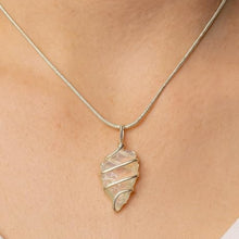 Load image into Gallery viewer, Opalite Arrowhead Pendant – Symbol of Transition, Clarity, and Inner Peace – Perfect for Unisex Wear - Side View | Natural Seven Chakra Crystal Pendant for Calmness &amp; Stress Relief

