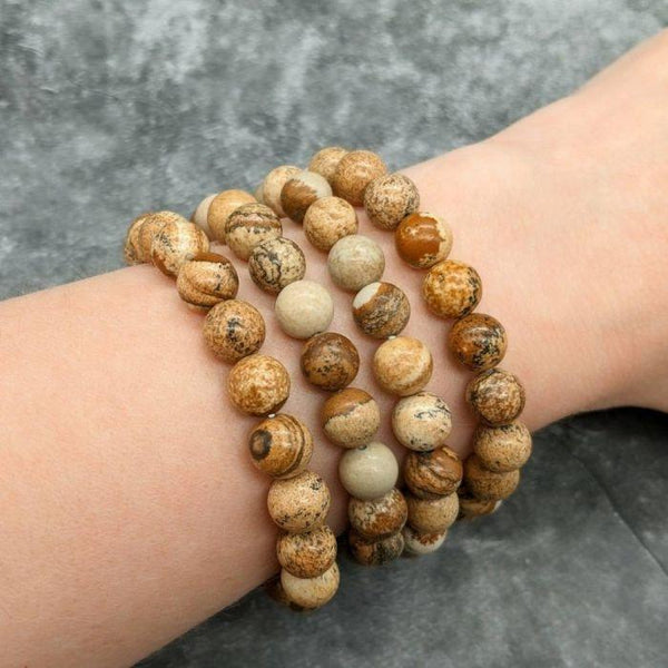 Lifestyle shot of a Picture Jasper bracelet on a person's wrist, emphasizing comfort and beauty.