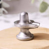 Realistic photo of a Parad Mercury Shivling with polished silver shine on a clean backdrop.